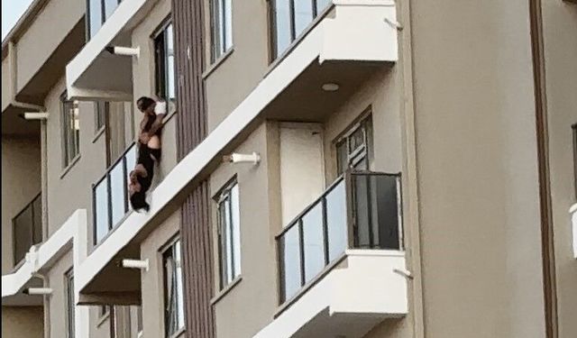 7. kattan atlayan kadını son anda tuttu